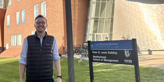 Vincent Heimburg standing before a building of Case Western Reserve University