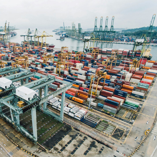 Stacked shipping containers at port.