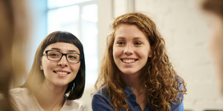 Picture of two young women smiling.