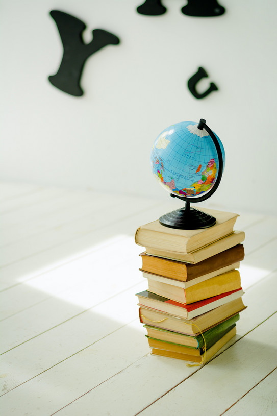 Photo: Globe standing on a stack of books