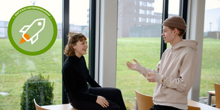 Woman and Man discussing something, logo of certificate Entrepreneuship in upper corner