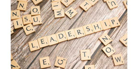 “Leadership” written with Scrabble tiles, on wooden slats