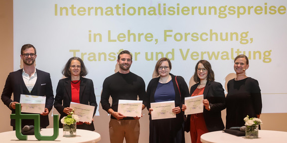 Picture of the award winners (from left): Professor Matthias Faes, Professor Angela Madeo, Dr. Maximilian Hartmann, Dr. Debra Hanning, and Frigga Göckede together with Vice President for International Affairs Professor Tessa Flatten (right).